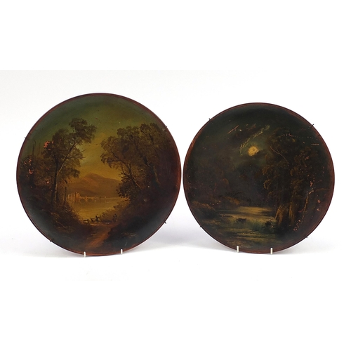 58 - Two Watcombe terracotta wall plaques hand painted with a waterfall and a river landscape, the larges... 