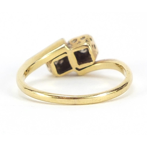 45 - 18ct gold and platinum diamond two stone crossover ring housed in a Spikins Wimbledon box, size L, 2... 