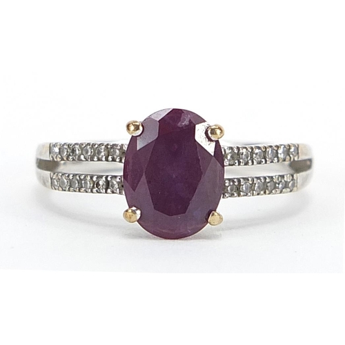 9 - 9ct white gold colour changing created Alexandrite ring with diamond set shoulders, stamped 0.10 to ... 