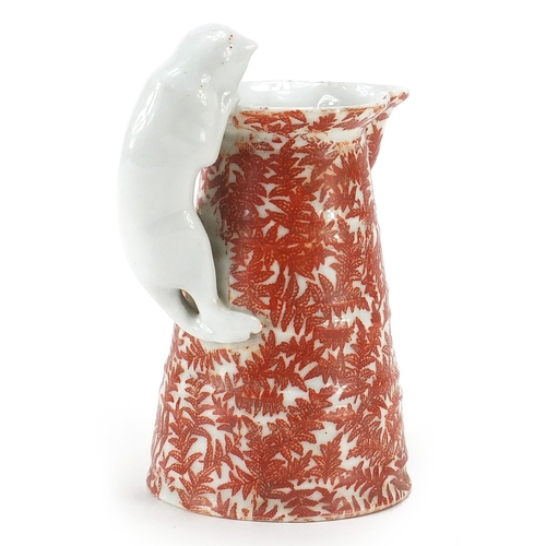 41 - Bohemian milk glass jug with cat design handle, 16cm high