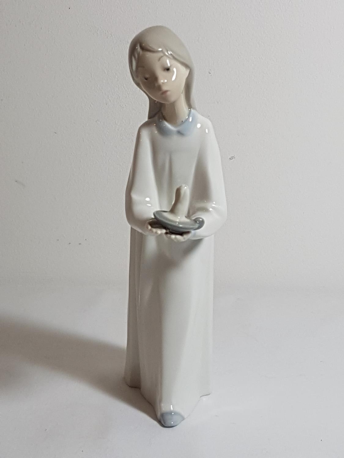 Lladro figure of a girl holding a candle