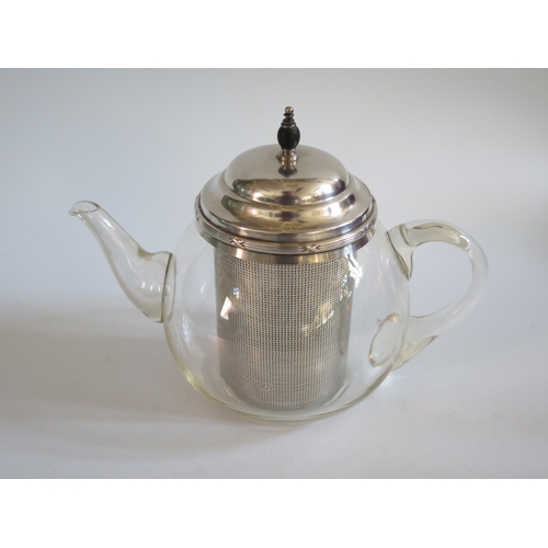 11 - A Pyrex Teapot with silver plated mounts