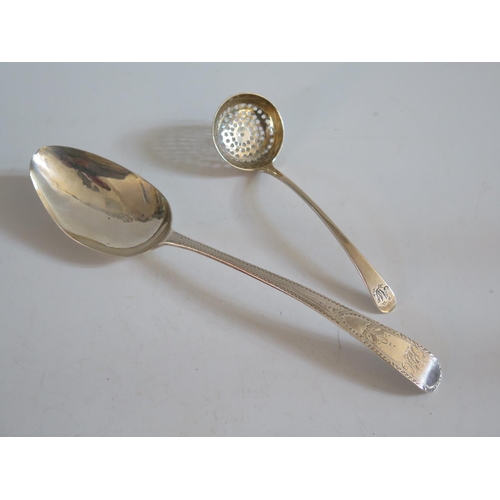 33 - A George III Bright Cut Silver Serving Spoon London 1788 George Wintle and sugar sifting spoon, c. 1... 