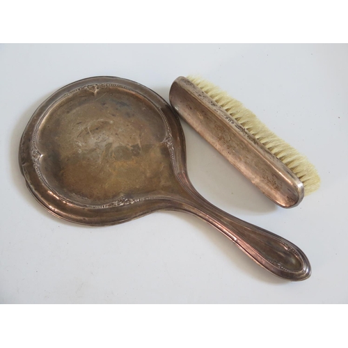 4 - A Silver Backed Hand Mirror, brush, napkin ring and guilloché enamel mirror and brush