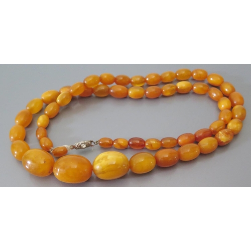 215a - A Butterscotch Amber Bead Necklace 42.9g (largest bead c. 22 x 16mm) AND bracelet 7.5g