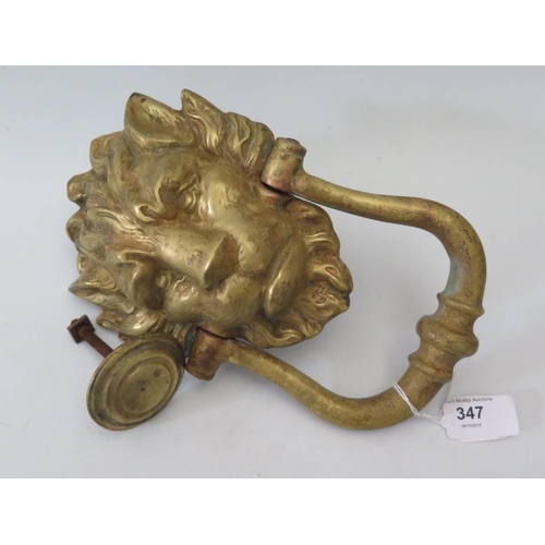 347 - A 19th Century gilt lion mask door knocker