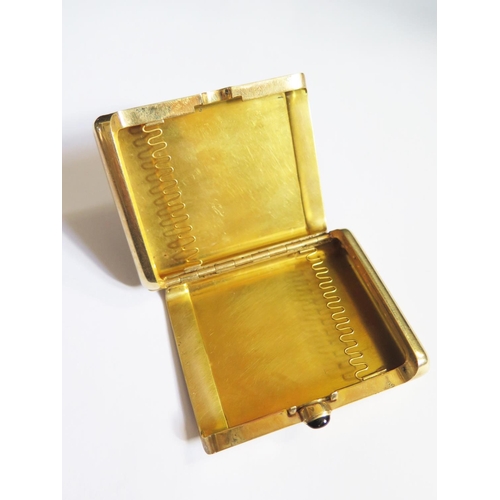 A Cartier 14K Gold Cigarette Case with cabochon button, stamped marks ...