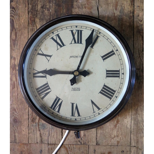 A Bakelite Cased Mains Powered Electric Wall Clock, 11" dial, running