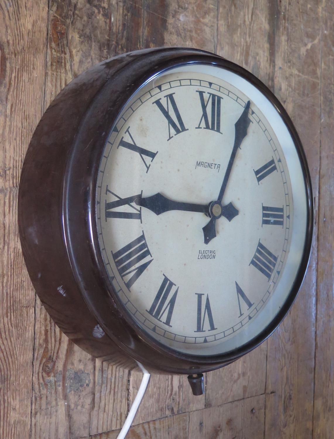 A Bakelite Cased Mains Powered Electric Wall Clock, 11" dial