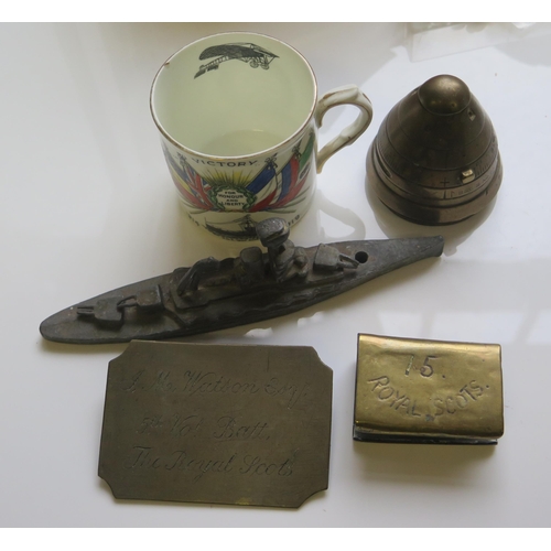 576 - A WWI Shell Nose Fuse, The Royal Scots plaque, vesta sleeve, lead waterline battleship model and com... 