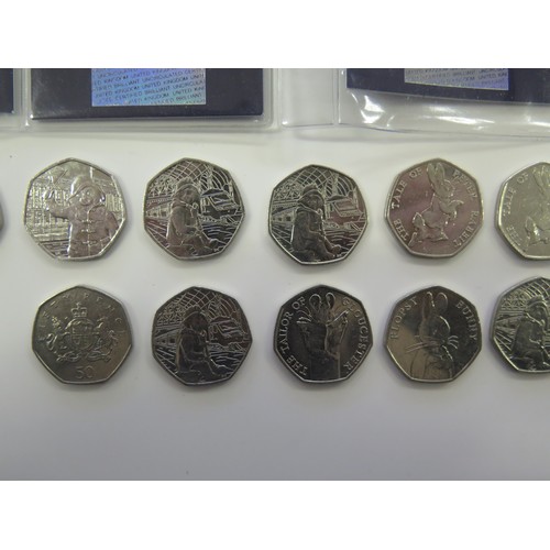 492 - A Collection Of 50p Picture Coins Including Peter Rabbit, sherlock Holmes, The Battle Of Britain, Et... 