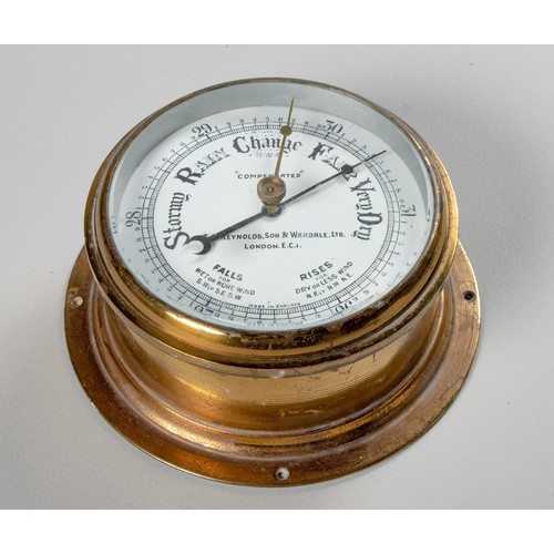 28 - A BRASS ANEROID BAROMETER, T. REYNOLDS AND SON