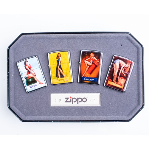 A SET OF FOUR CASED ZIPPO PIN-UP GIRL LIGHTERS