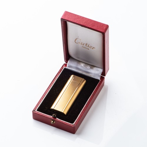 64 - A GOLD-PLATED CARTIER LIGHTERAccompanied by original box and papers, 6,8cm high... 
