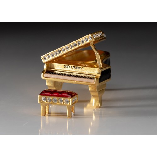 42 - AN ESTEE LAUDER SOLID PERFUME COMPACT, BABY GRAND, 2000