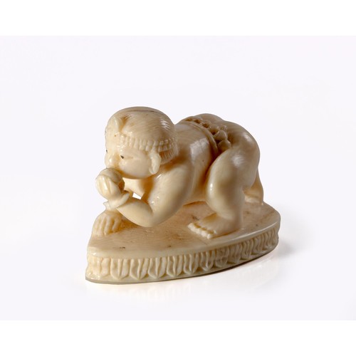 783 - AN INDIAN IVORY CARVING OF KRISHNA AS AN INFANT, EARLY 20TH CENTURY