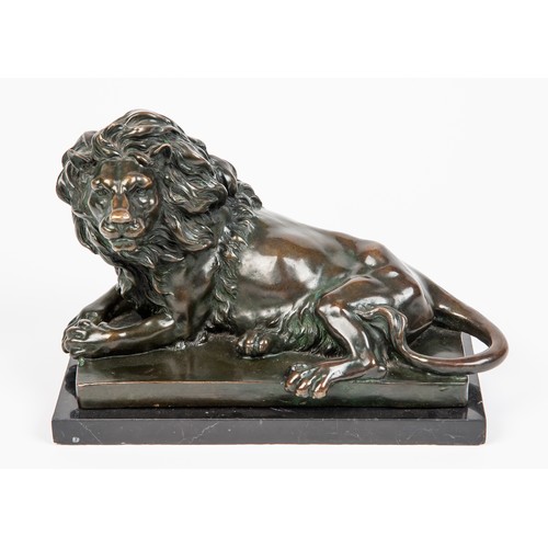 500 - AFTER ANTOINE LOUIS BARYE ( FRENCH 1795-1875): A BRONZE FIGURE OF A RECUMBENT LION... 