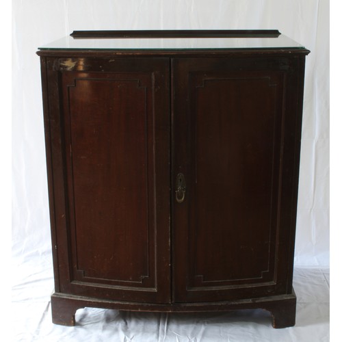 34 - An Unusual Late Victorian Mahogany Press Cupboard. Circa 1890. With a pair of doors opening to revea... 