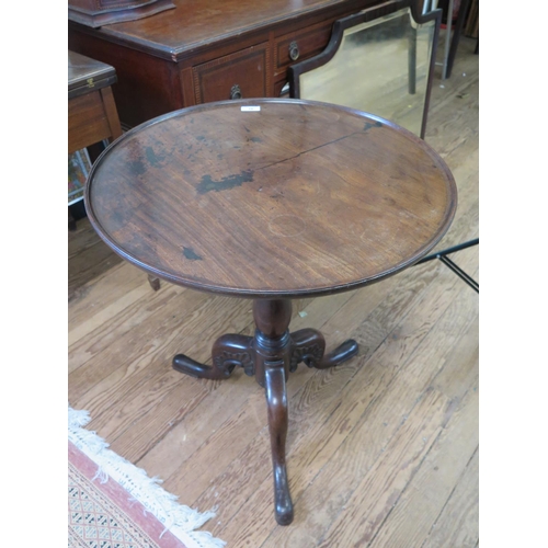 16 - A Fine Irish 18th Century Mahogany Wine Table. Circa 1760. The circular top with moulded rim. On sle... 