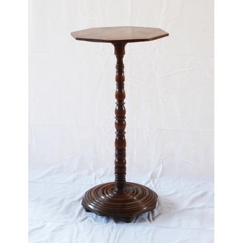 20 - A Victorian Wine Table. Second half of the 19th century. With an Octagonal top above a turned column... 