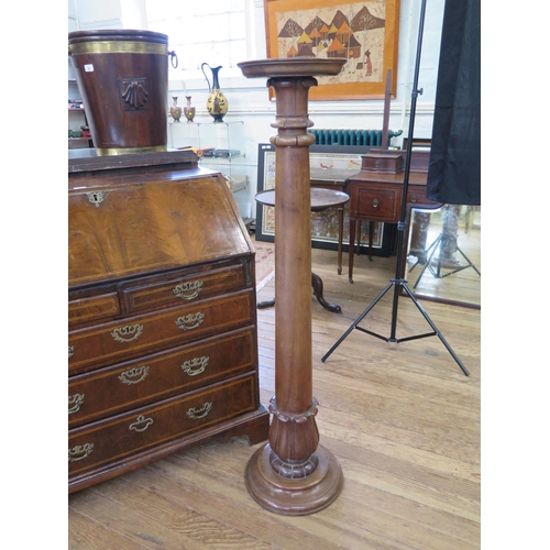 21 - A Victorian Mahogany Jardinière Stand. Circa 1840. In the form of a column. 137cm high. Some old dam... 