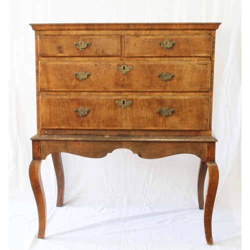 33 - A George I Walnut Chest on Stand. Circa 1715. Fitted with three long graduated drawers. On a stand w... 
