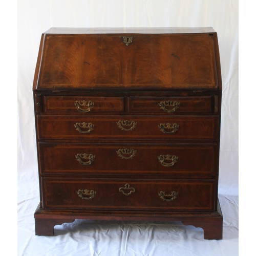 35 - A George Mahogany Bureau. Circa 1780. Oy typical form. The fall front opening to reveal a fitted int... 
