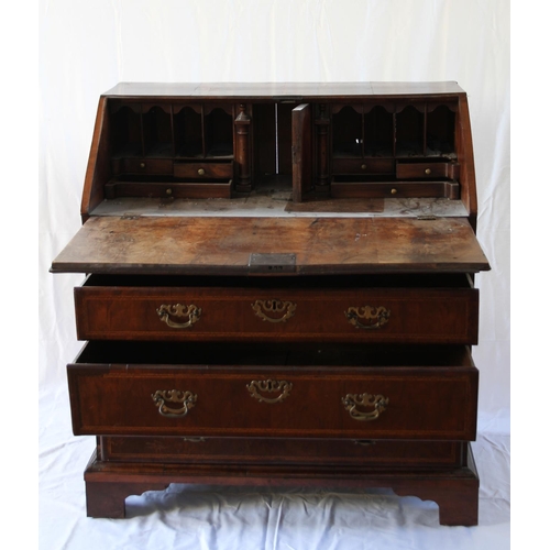 35 - A George Mahogany Bureau. Circa 1780. Oy typical form. The fall front opening to reveal a fitted int... 