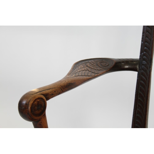 43 - A Fine Irish Mahogany Arm Chair. Cira 1740. The splat carved with foliate scrolls on matted ground. ... 