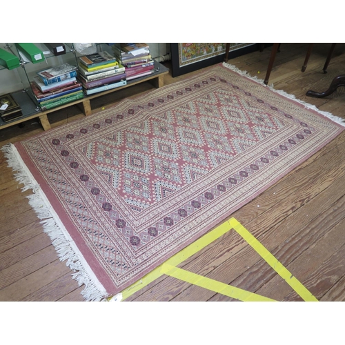 48 - A Bokara style rug with geometric motifs on a dark pink ground, within a multiple border, 206cm x 12... 