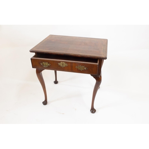 55A - A George II Irish Walnut Side Table. Circa 1740. Fitted with a single frieze drawer. On cabriole leg... 