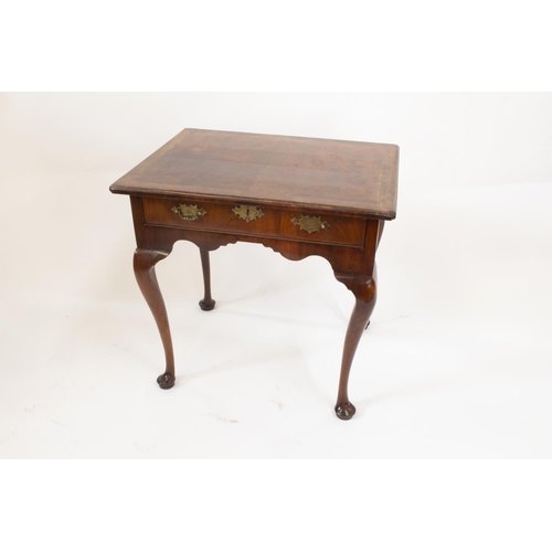 55A - A George II Irish Walnut Side Table. Circa 1740. Fitted with a single frieze drawer. On cabriole leg... 