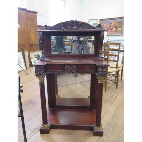 9 - A Regency Mahogany Mirrored Chiffonier. Circa 1815. With a leaf carved frieze above lions paw scroll... 