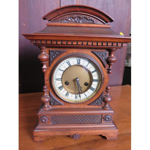 58 - A Late Victorian Oak Cased Mantel Clock, with key