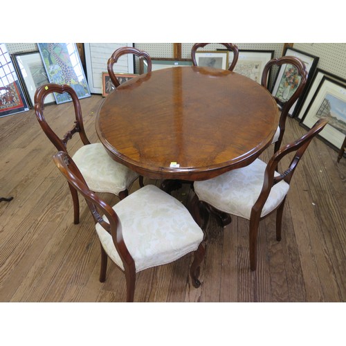 49 - A Fine Victorian Walnut Oval Dining Table. Circa 1850. Together with six balloon back dining chairs.... 