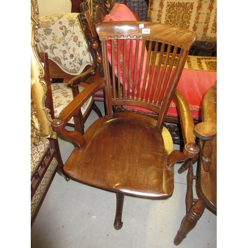 2350 - Early 20th Century mahogany open arm revolving office chair having slatted back, on cabriole support... 