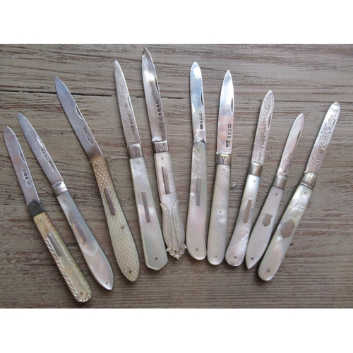 827 - Collection of ten 19th and 20th Century silver bladed and mother of pearl handled folding fruit kniv... 