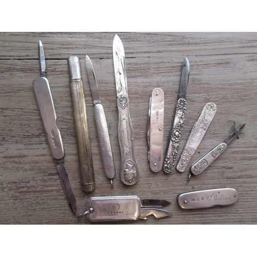 838 - Collection of ten various silver, silver plated and white metal folding fruit knives