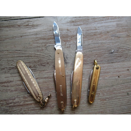 840 - 9ct Gold folding fruit knife with steel blades, together with three other yellow metal and gold plat... 