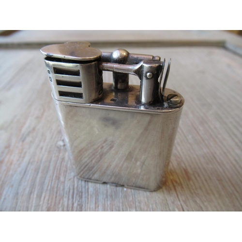 854 - Dunhill ' Unique ' London silver mounted sports lighter (no case), 2.25ins high