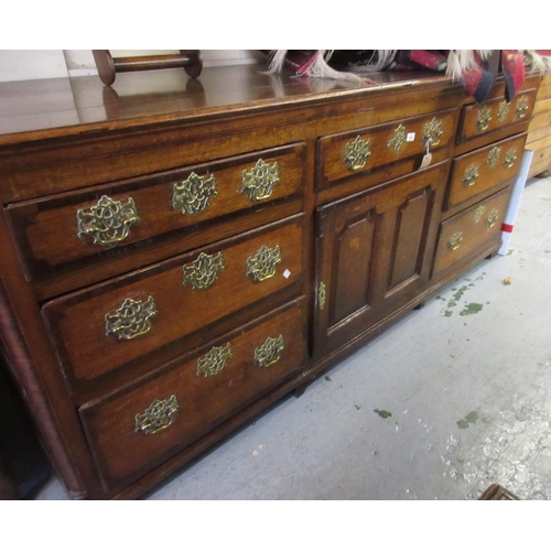 1342 - 18th Century oak and mahogany banded dresser, the plank top above centre drawer and panelled door fl... 