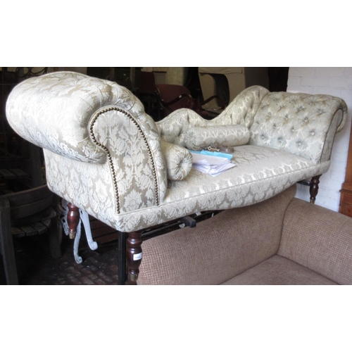 1394 - Reproduction chaise longue in Victorian style covered in deep buttoned pale green damask, raised on ... 