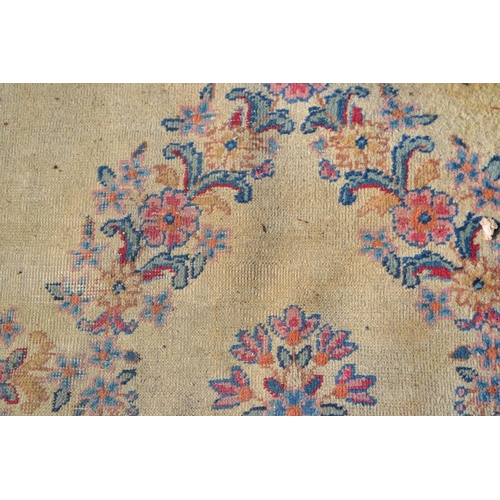 40 - Pair of small Indian carpets, each with a medallion and floral design on an ivory ground, each 10ft ... 
