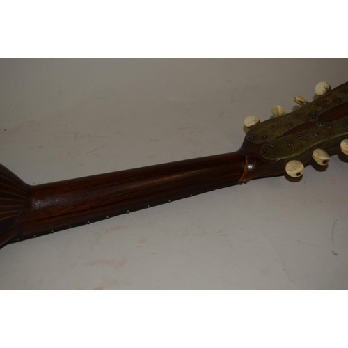 103B - 19th Century rosewood and line inlaid mandolin, the spruce top with tortoiseshell and mother of pear... 
