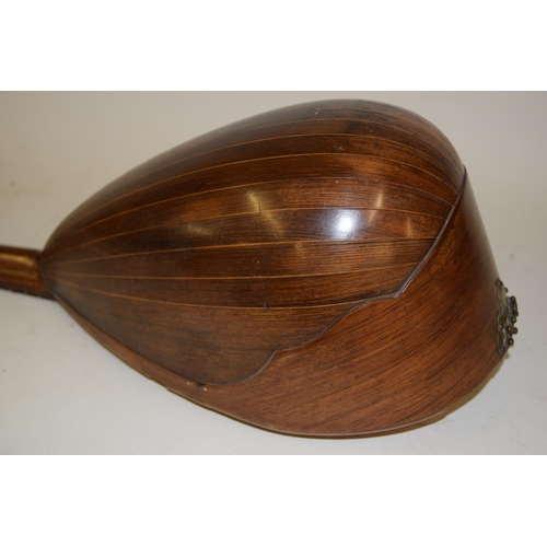 103B - 19th Century rosewood and line inlaid mandolin, the spruce top with tortoiseshell and mother of pear... 