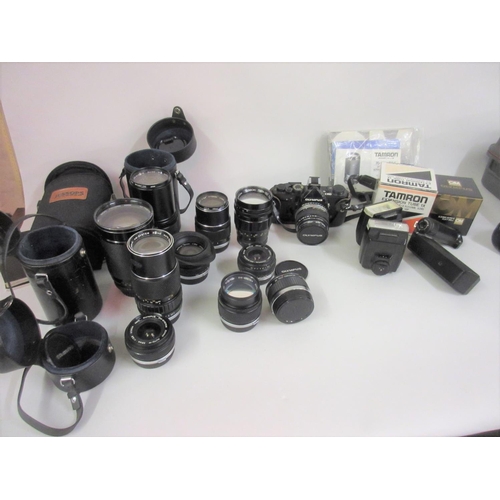 110 - Olympus OM 1 camera system with 50mm 1.4 lens and several other wide angle and telephoto lenses, mos... 