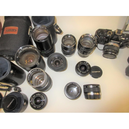 110 - Olympus OM 1 camera system with 50mm 1.4 lens and several other wide angle and telephoto lenses, mos... 