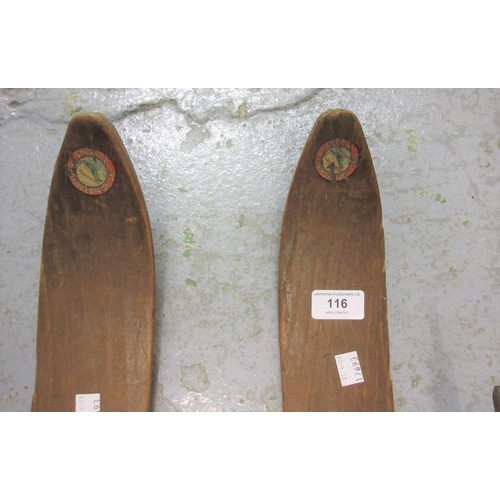 116 - Pair of early to mid 20th Century wooden skis with bamboo poles marked Spezial Riesengebirgs