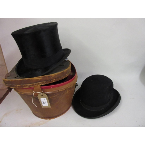 134 - 19th Century brown leather hat box (at fault) containing gentleman's top hat and bowler hat
