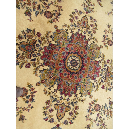 1 - Wilton type machine woven carpet with a medallion and floral design on a beige ground with borders, ... 